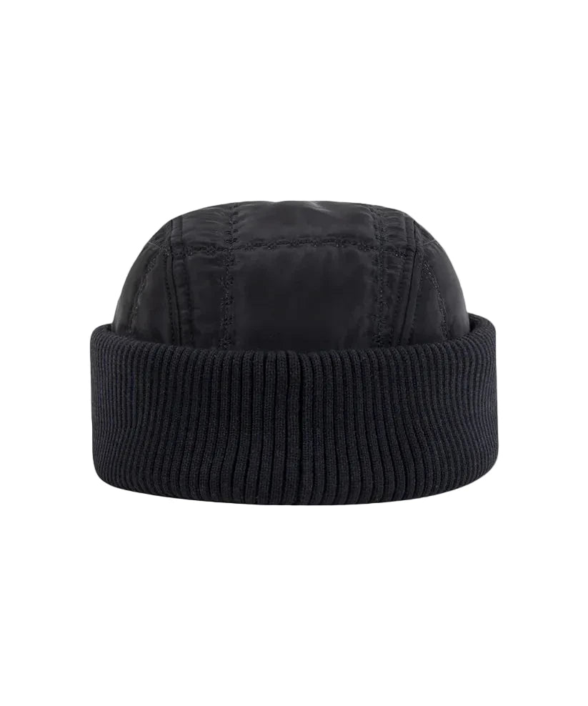 Paper Plane black quilted polyester beanie with rolled rib cuff and debossed silicone patch, final sale item.