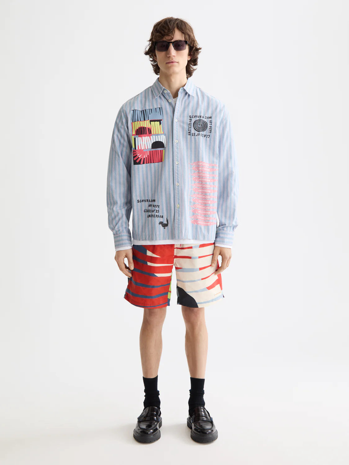 “Mid-length swim shorts with bold print and adjustable drawstring waistband”