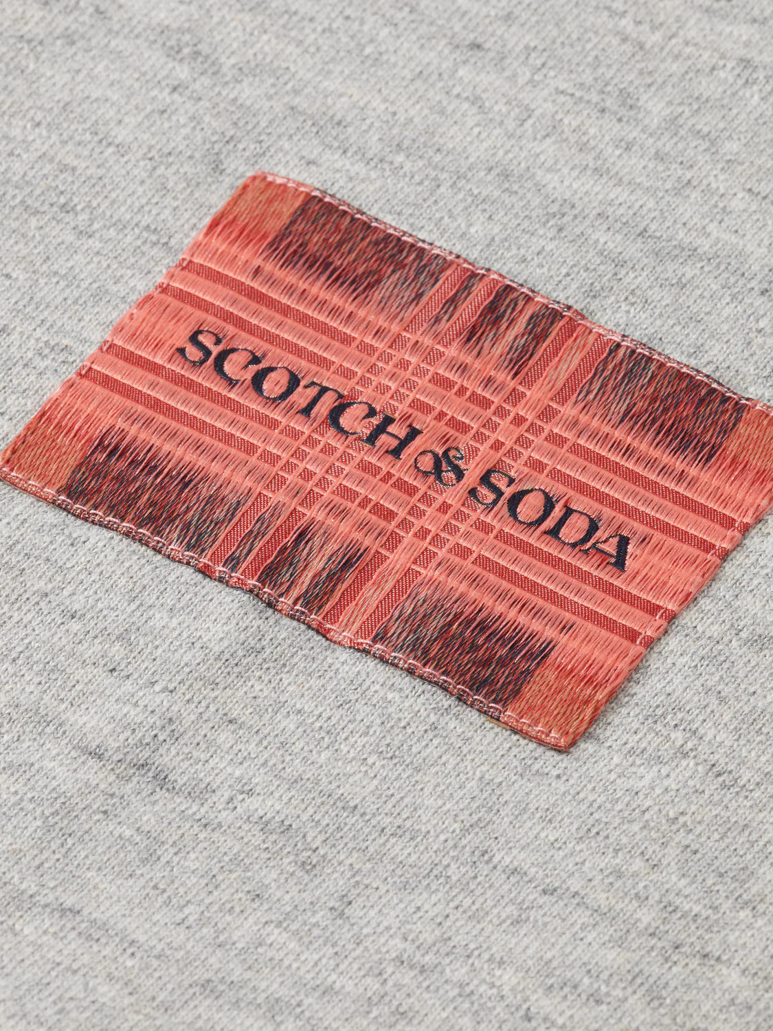 Scotch & Soda loose-fit sweatshirt with intricate label detailing and relaxed silhouette
