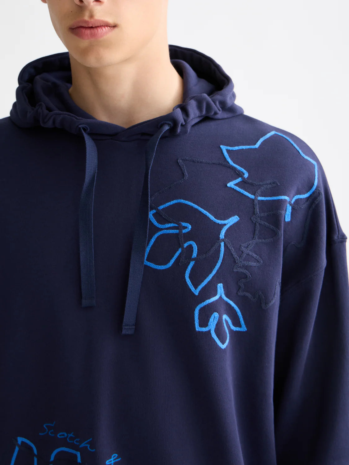 Scotch & Soda loose-fit hoodie with bold embroidered artwork and relaxed silhouette