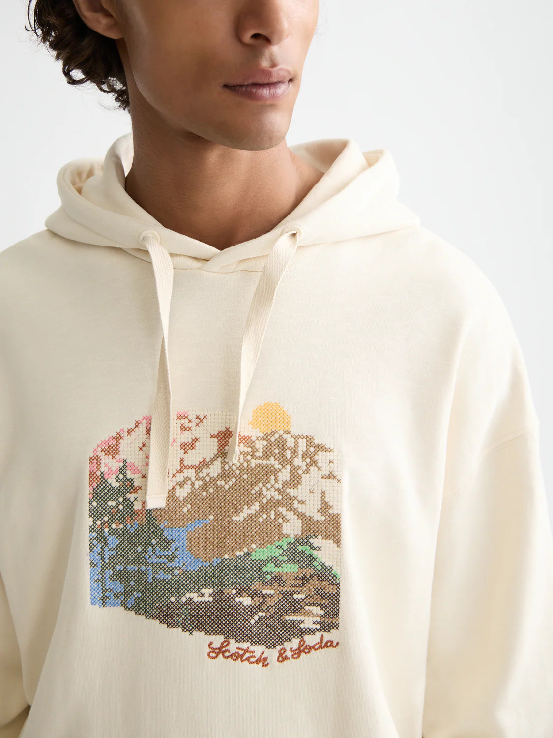 Scotch & Soda loose-fit hoodie with bold embroidered artwork and relaxed silhouette