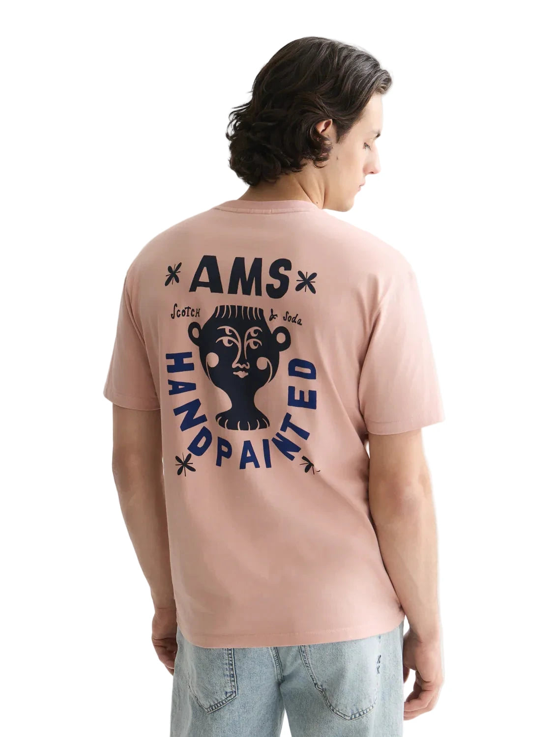 Misty Rose relaxed-fit T-shirt featuring front and back logo artwork, soft cotton construction, and a comfortable everyday silhouette.