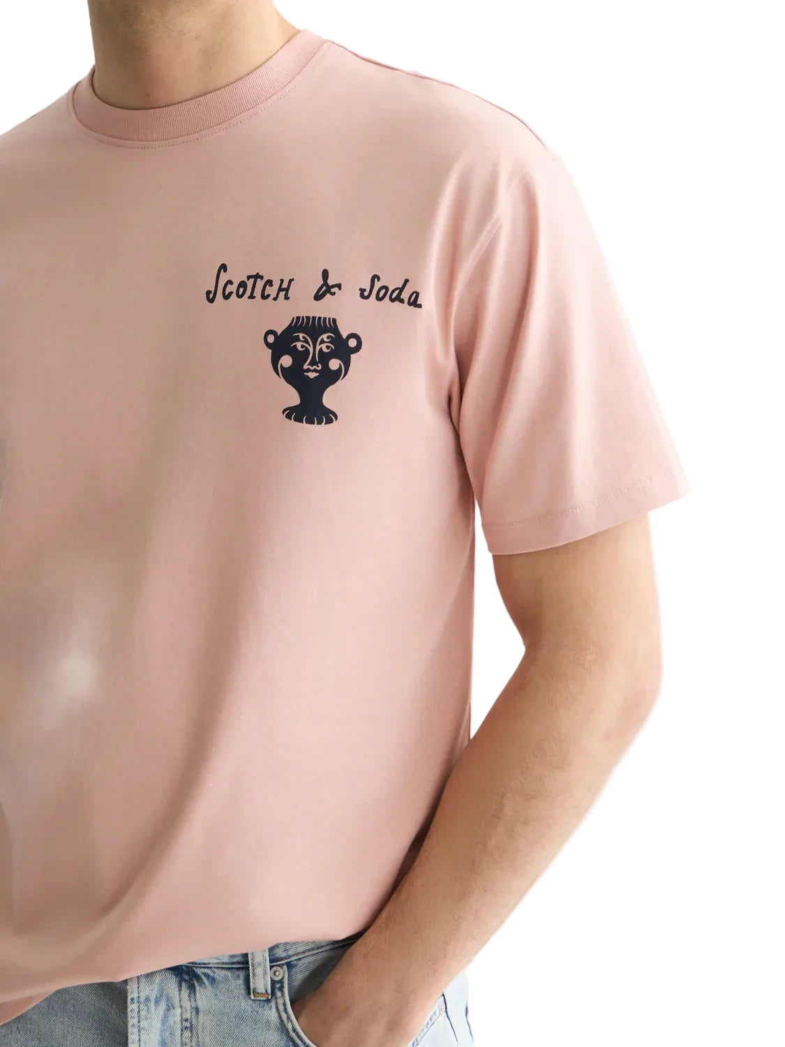 Misty Rose relaxed-fit T-shirt featuring front and back logo artwork, soft cotton construction, and a comfortable everyday silhouette.