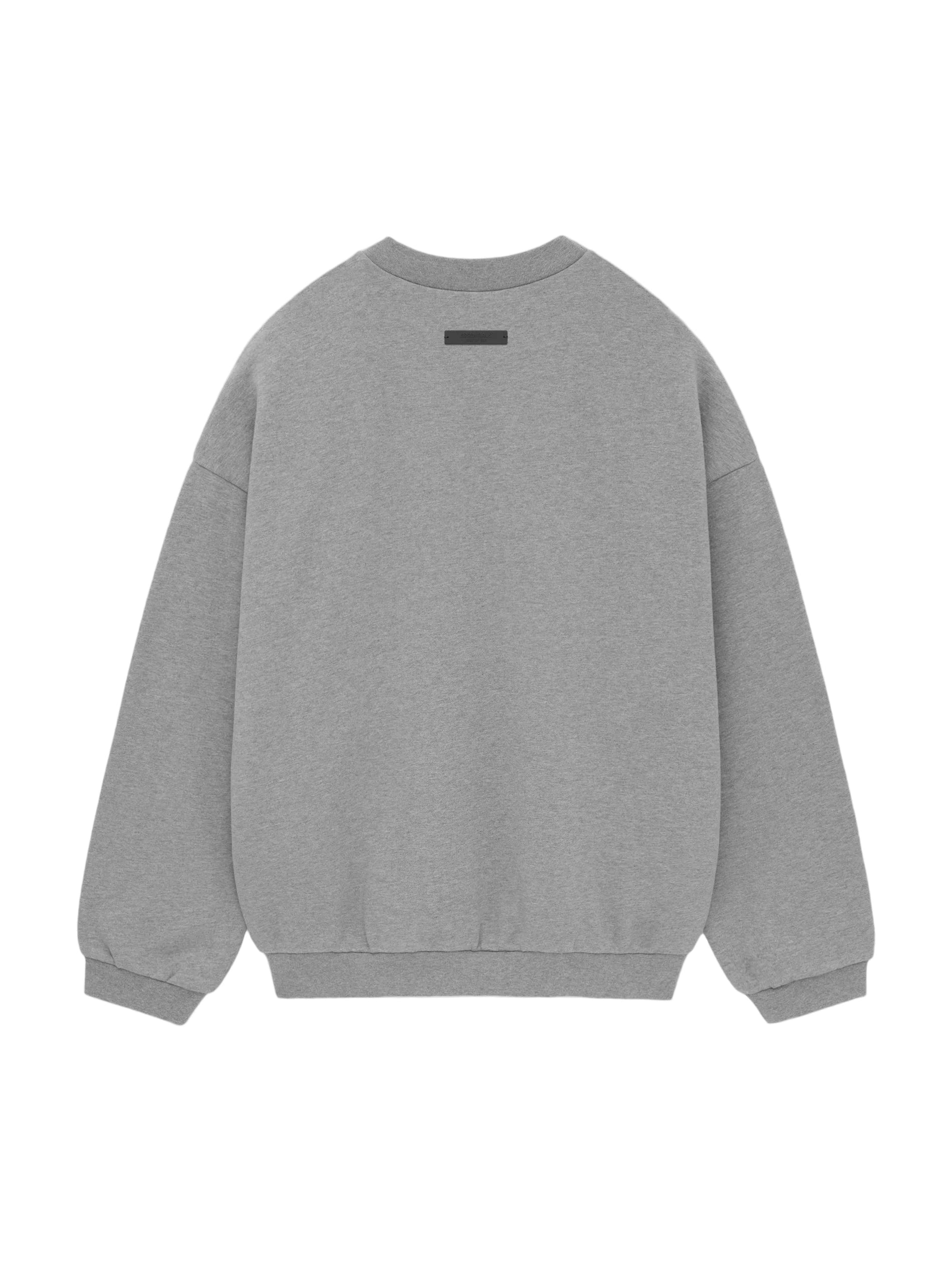 The Essentials Fleece Crewneck has been updated in a heavier 480gsm core fleece to provide additional body and structure. A collegiate-inspired "Fear of God State" graphic is screen printed on the front. Details include a rib-knit collar, cuffs, and waist-hem. The Essentials Fear of God rubberized label is at the back collar.
