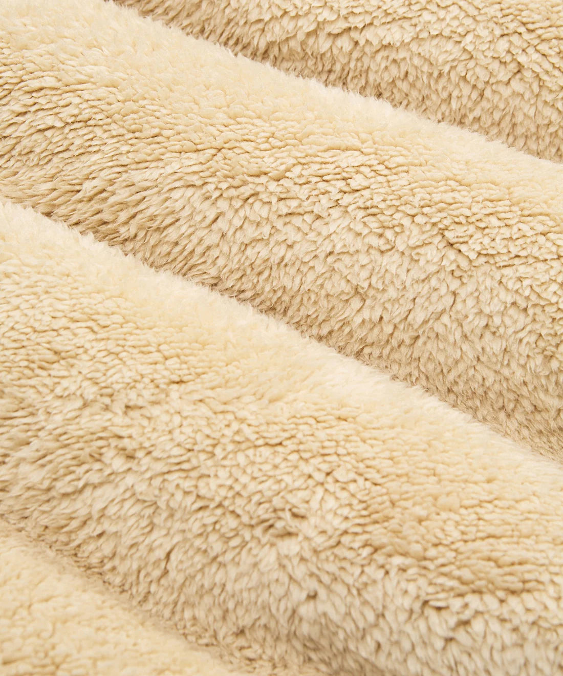 Paper Plane ecru sherpa half-zip pullover with faux sherpa letter appliqué, kangaroo pocket, and relaxed fit.