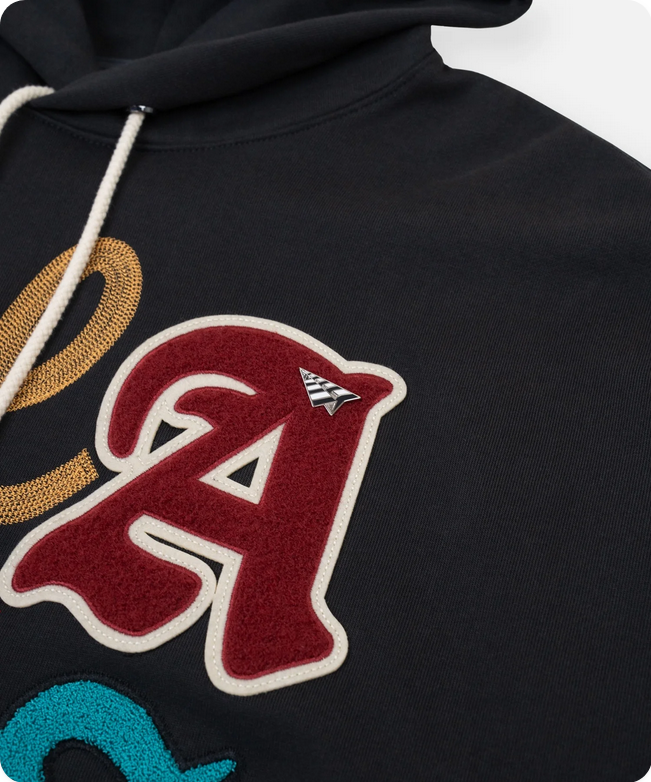 Paper Plane Planes Letterman hoodie in charcoal with embroidered front detailing and branded accents.