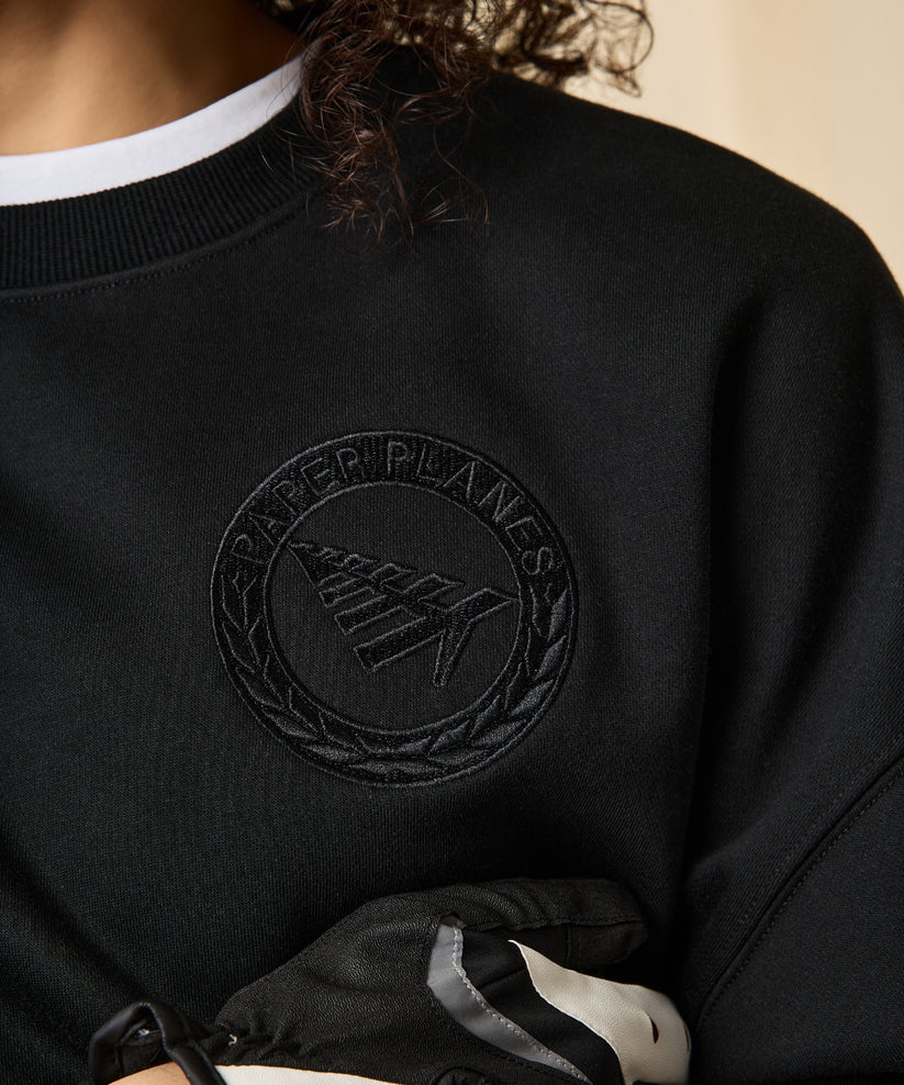 Paper Planes Relaxed FC Crewneck Sweatshirt in fleece with embroidered front, 3D applique back detail, and silicone flag.