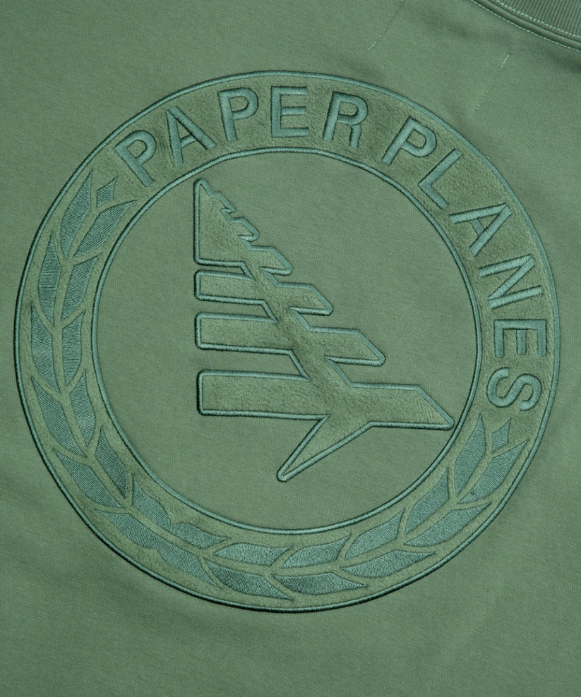 Paper Planes Relaxed FC Crewneck Sweatshirt in fleece with embroidered front, 3D applique on back, and silicone flag detail.