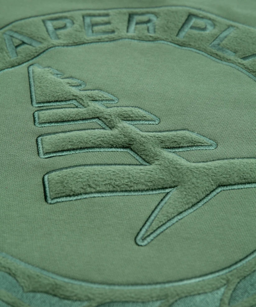 Paper Planes Relaxed FC Crewneck Sweatshirt in fleece with embroidered front, 3D applique on back, and silicone flag detail.