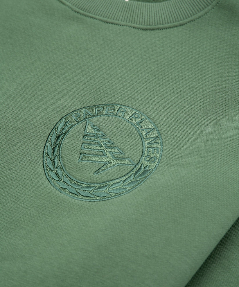 Paper Planes Relaxed FC Crewneck Sweatshirt in fleece with embroidered front, 3D applique on back, and silicone flag detail.