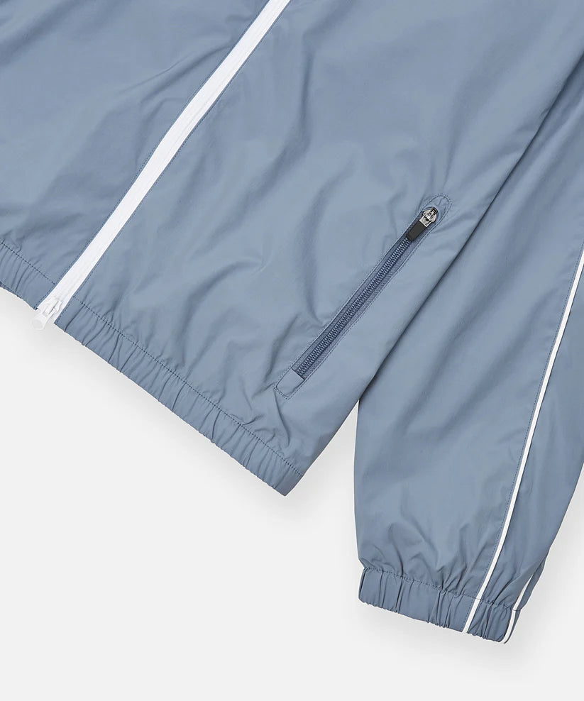 Paper Plane Planes Lounge lightweight track jacket with raglan sleeves, zip pockets, and water-resistant nylon fabric.
