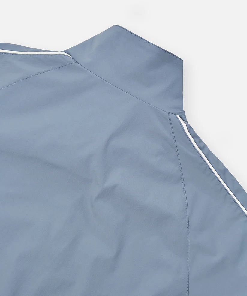 Paper Plane Planes Lounge lightweight track jacket with raglan sleeves, zip pockets, and water-resistant nylon fabric.