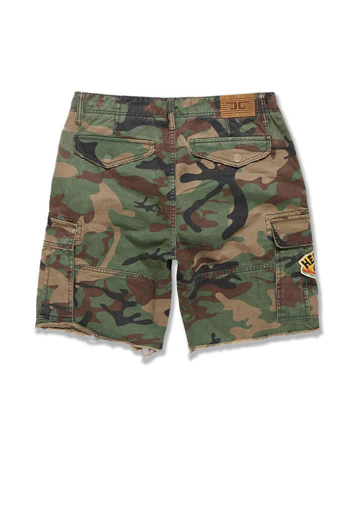Jordan Craig Retro War Angel cargo shorts with camo print, stitched patches, and raw edge detailing in relaxed streetwear fit