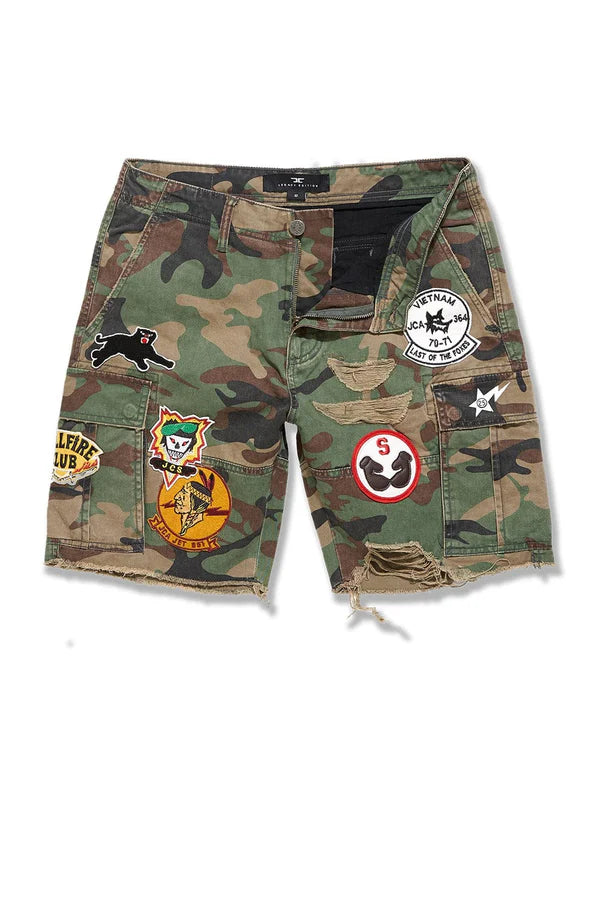 Jordan Craig Retro War Angel cargo shorts with camo print, stitched patches, and raw edge detailing in relaxed streetwear fit
