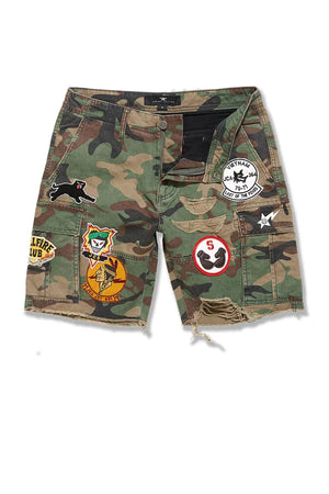 Jordan Craig Retro War Angel cargo shorts with camo print, stitched patches, and raw edge detailing in relaxed streetwear fit