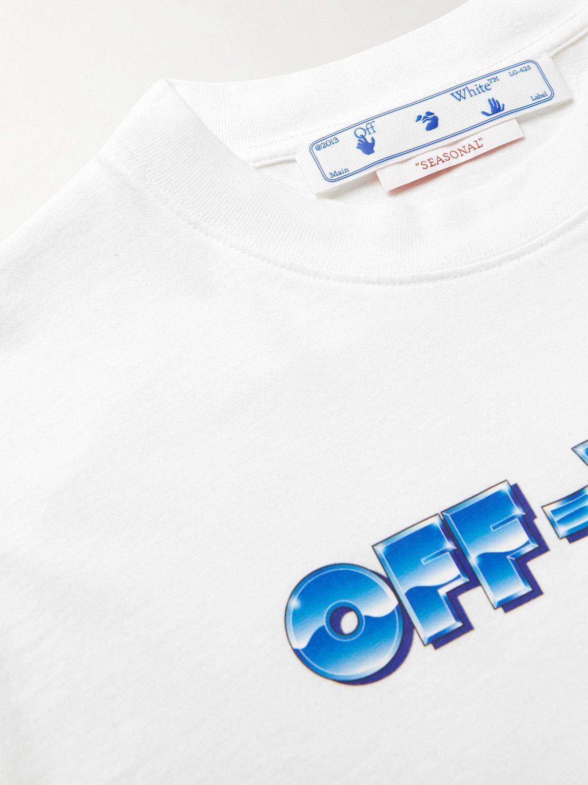 OFF-WHITE Metal Arrow Skate T-shirt in white with chest logo print and seasonal graphic on the back.