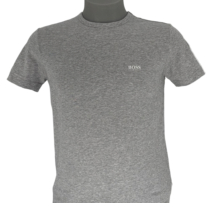 Clean, sharp, and effortlessly premium — the Hugo Boss Basic T-Shirt (Grey) featuring a bold white logo across the front with matching shoulder branding delivers everyday luxury with a modern streetwear identity.