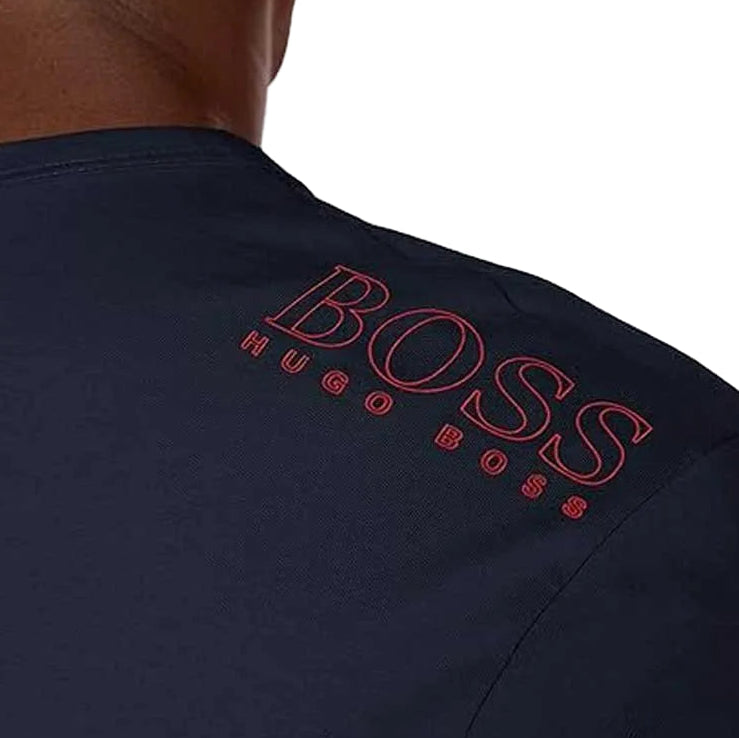 Upgrade your everyday style with the Hugo Boss Basic Tee in Navy Blue, featuring a bold red BOSS front logo and matching red logo detail on the back neck. 