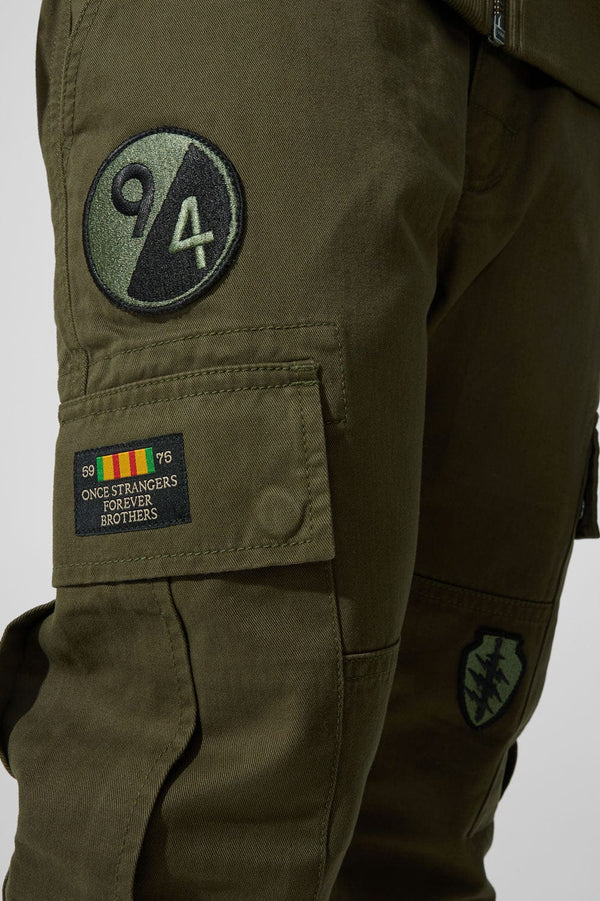 Xavier Prestige Tonal Cargo Pants in cotton with loose hip-to-thigh fit, tapered legs, functional cargo pockets, and tonal embroidered patches