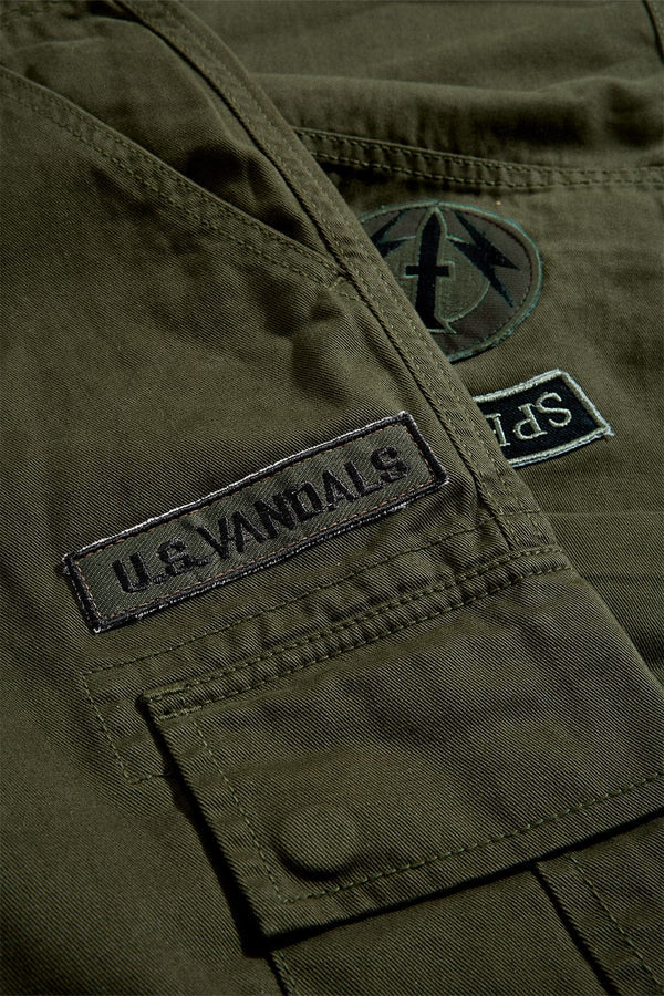 Xavier Prestige Tonal Cargo Pants in cotton with loose hip-to-thigh fit, tapered legs, functional cargo pockets, and tonal embroidered patches