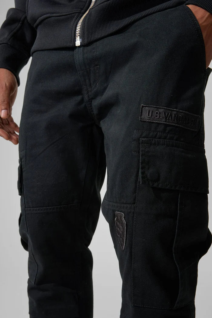 Xavier Prestige Tonal Cargo Pants in cotton with loose hip-to-thigh fit, tapered legs, functional cargo pockets, and tonal embroidered patches
