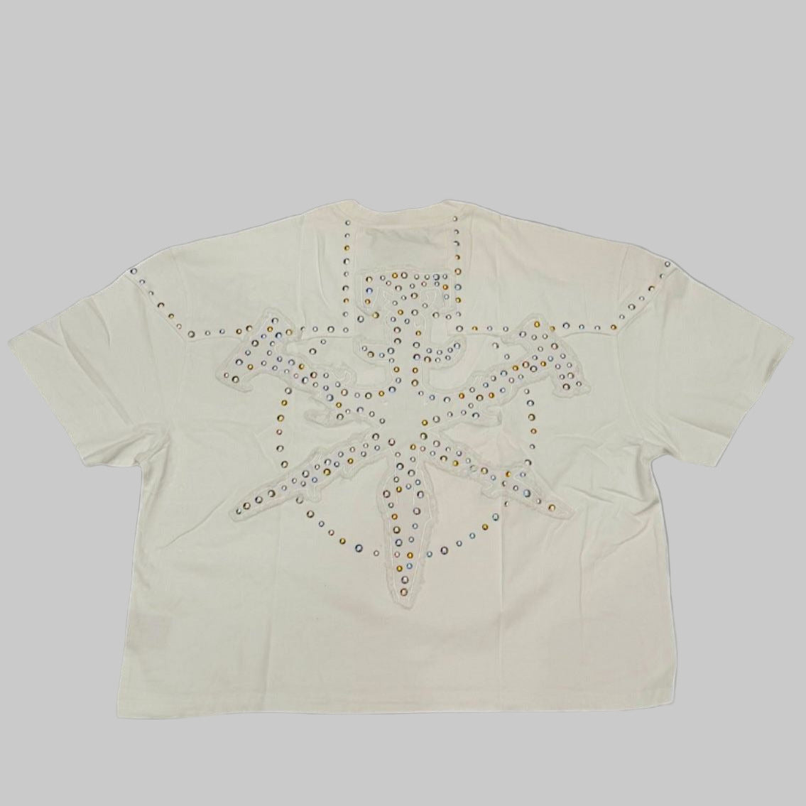 The HUDSON OUTERWEAR Swords Studs T-Shirt comes in white and features distinctive sword and stud detailing. Designed in a regular fit, this T-shirt offers a bold look while maintaining everyday wearability.