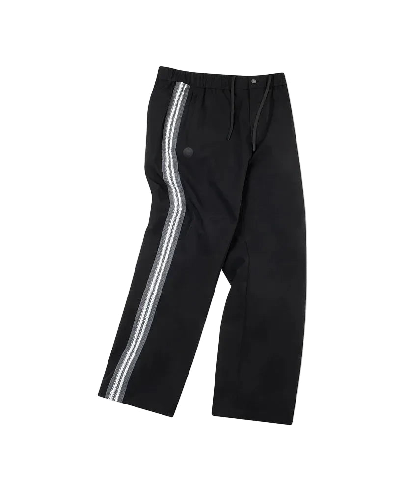 Paper Plane black Planes Crochet track pants with crochet side panels and water-resistant nylon fabric.