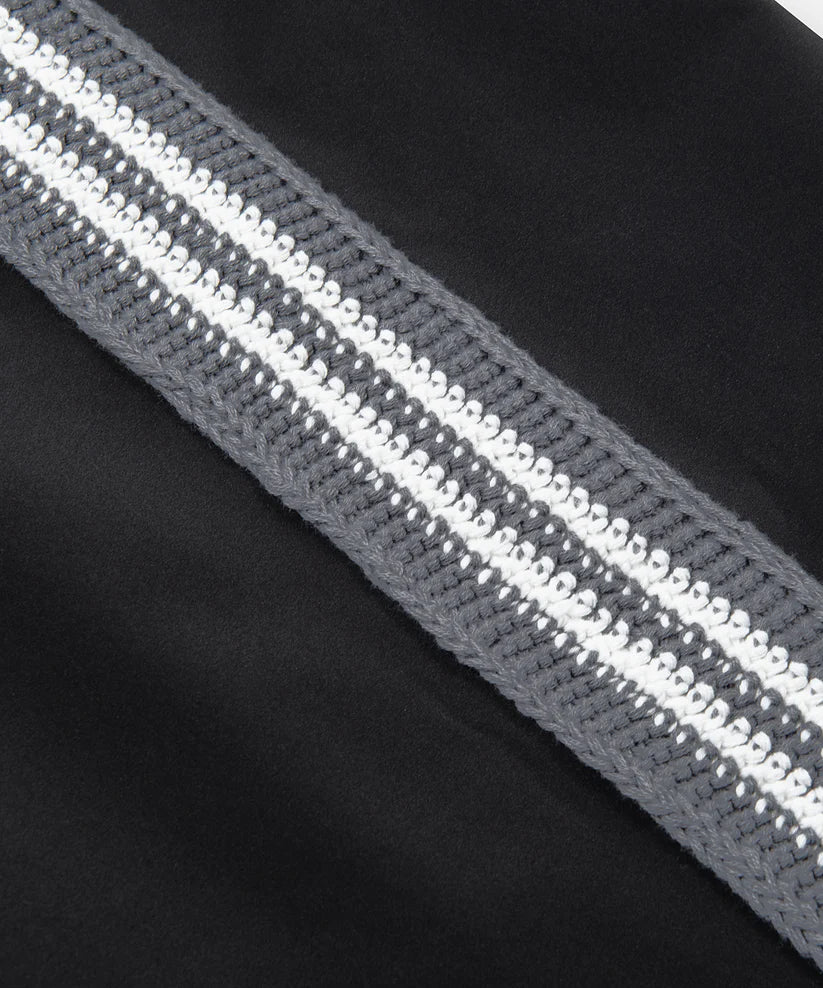 Paper Plane black Planes Crochet track pants with crochet side panels and water-resistant nylon fabric.