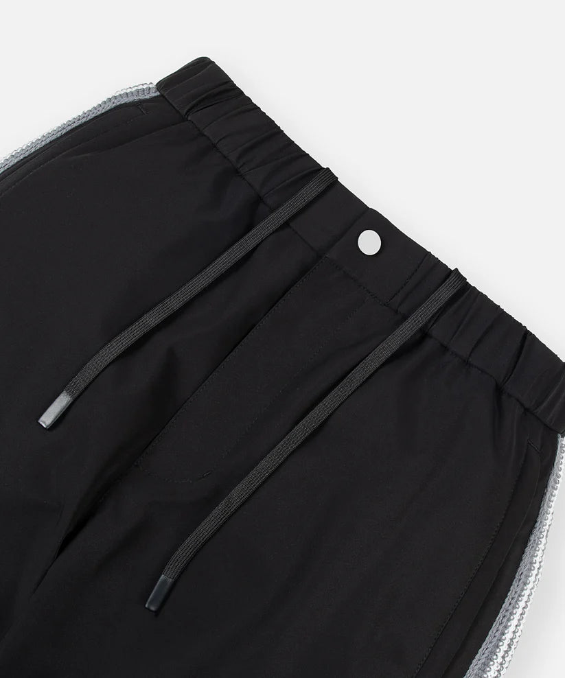 Paper Plane black Planes Crochet track pants with crochet side panels and water-resistant nylon fabric.