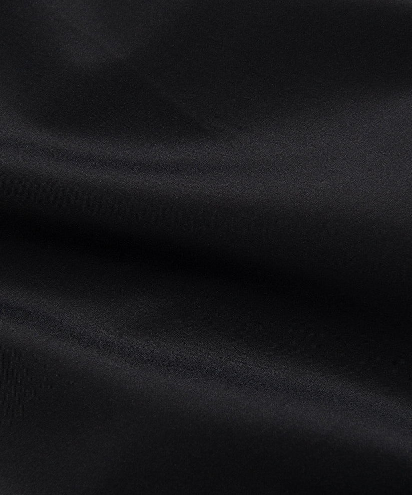 Paper Plane black Planes Crochet track pants with crochet side panels and water-resistant nylon fabric.