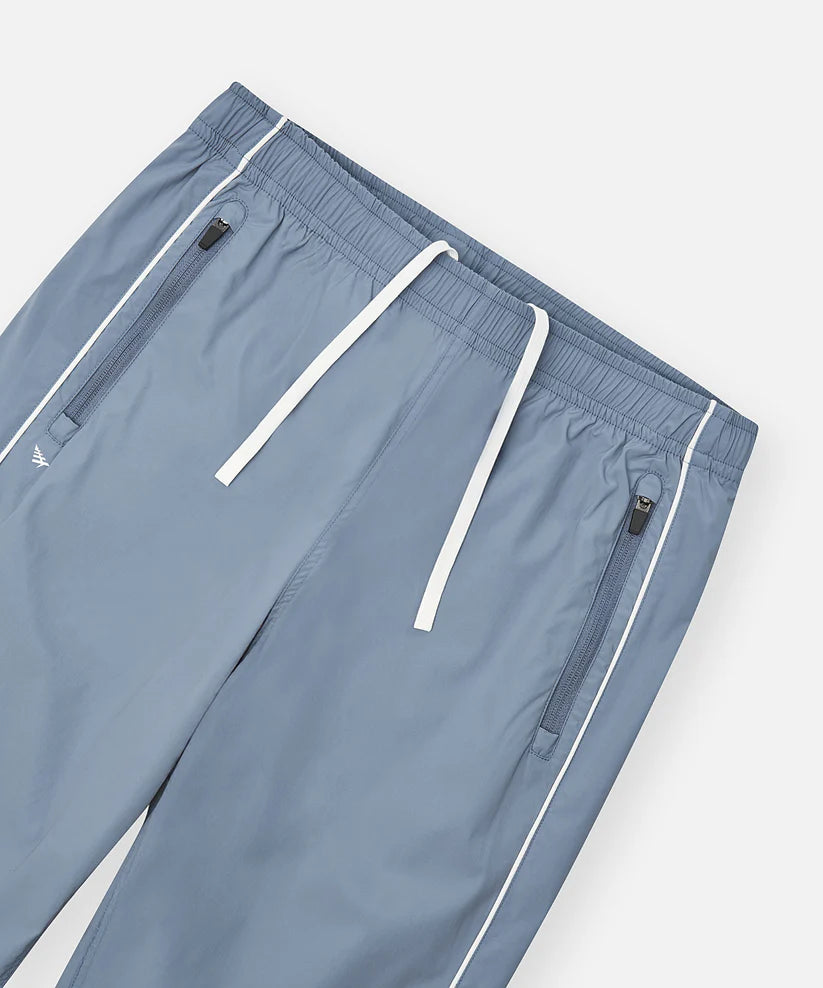 Paper Plane Planes Lounge track pants with corded piping side panels and water-resistant nylon fabric.