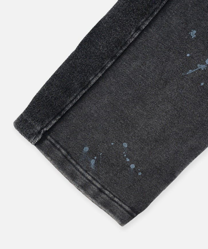 Paper Plane black heavyweight sweatpants with splatter effect, zippered pockets, and elastic waistband.