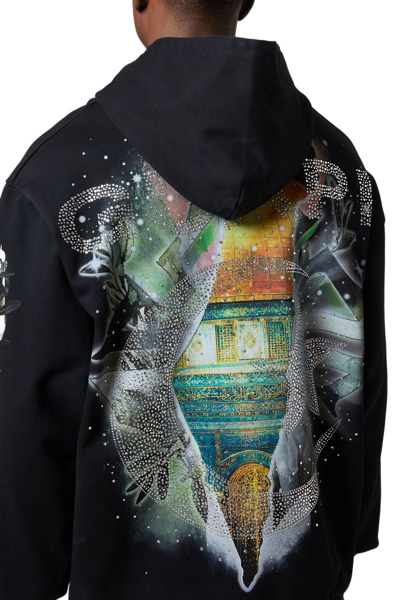 GUAPI Free Palestine Hoodie in black with oversized fit, multicolor front graphic, Dome of the Rock artwork on back, and rhinestone embellishments.