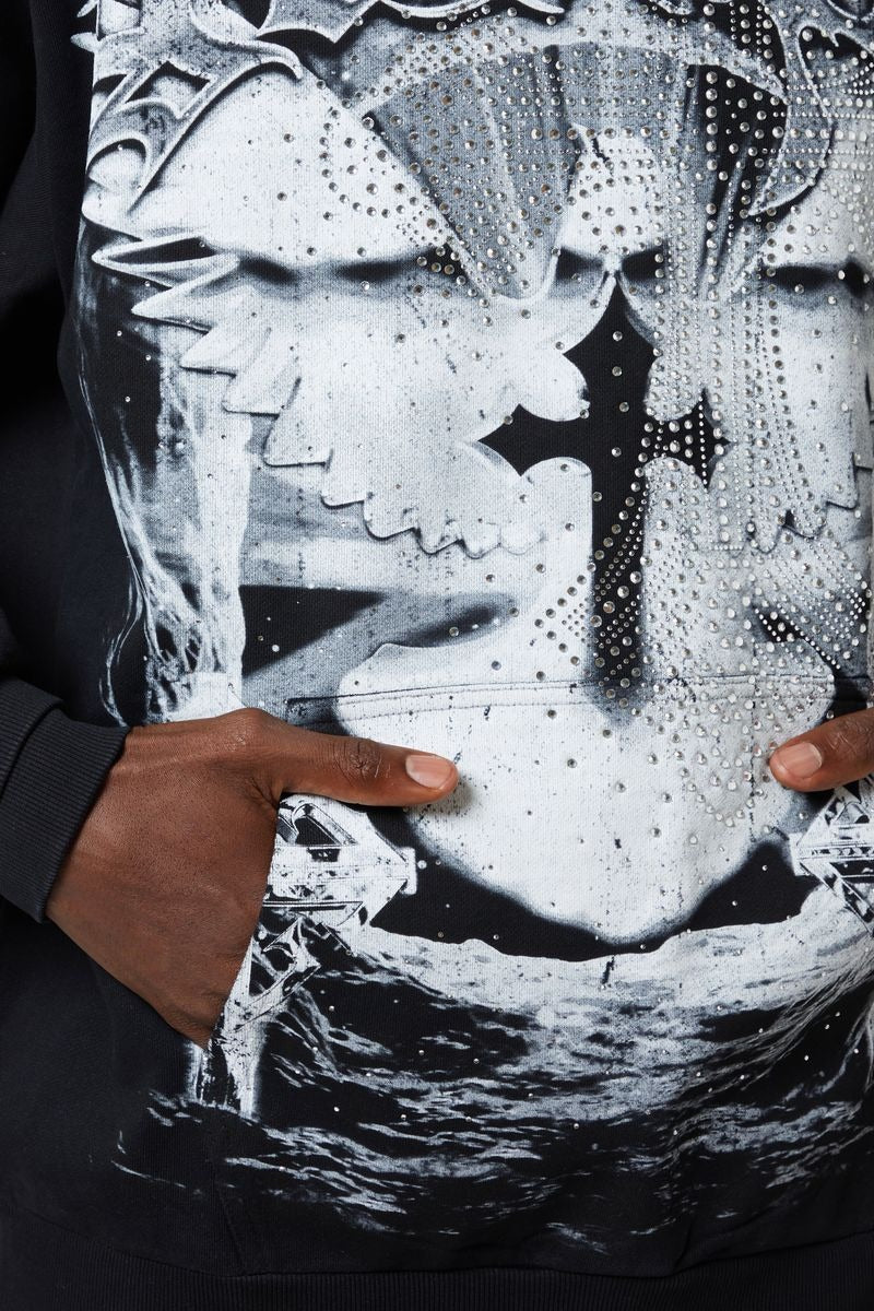 GUAPI Heavens Vault Hoodie V3 in jet black with ice blue and white graphics, crystal rhinestone embellishments, double-eagle front print, cosmic back emblem, and oversized drop-shoulder fit.