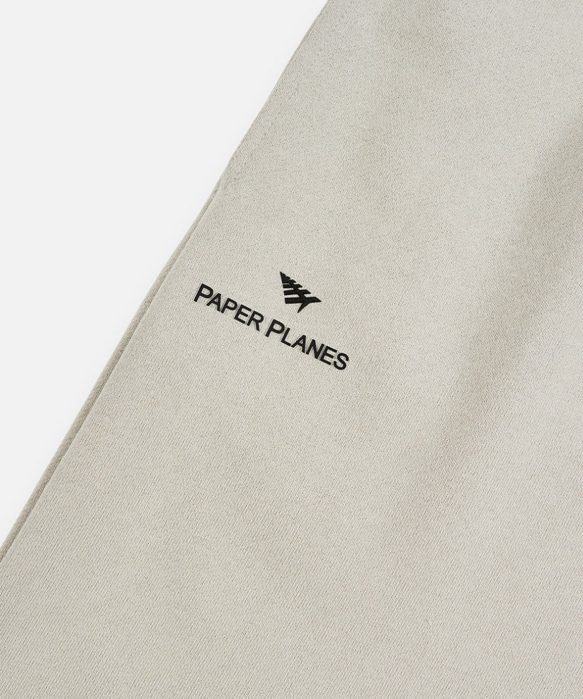 Paper Planes Lockup shorts in grey with heavyweight French Terry cotton, classic fit, silicone logo detail, and hidden media pockets.