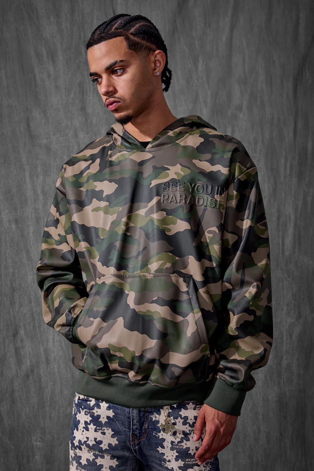 See You in Paradise Vintage Camo hoodie with digital camo print, embossed chest and back logo, vegan leather finish, and kangaroo pocket.
