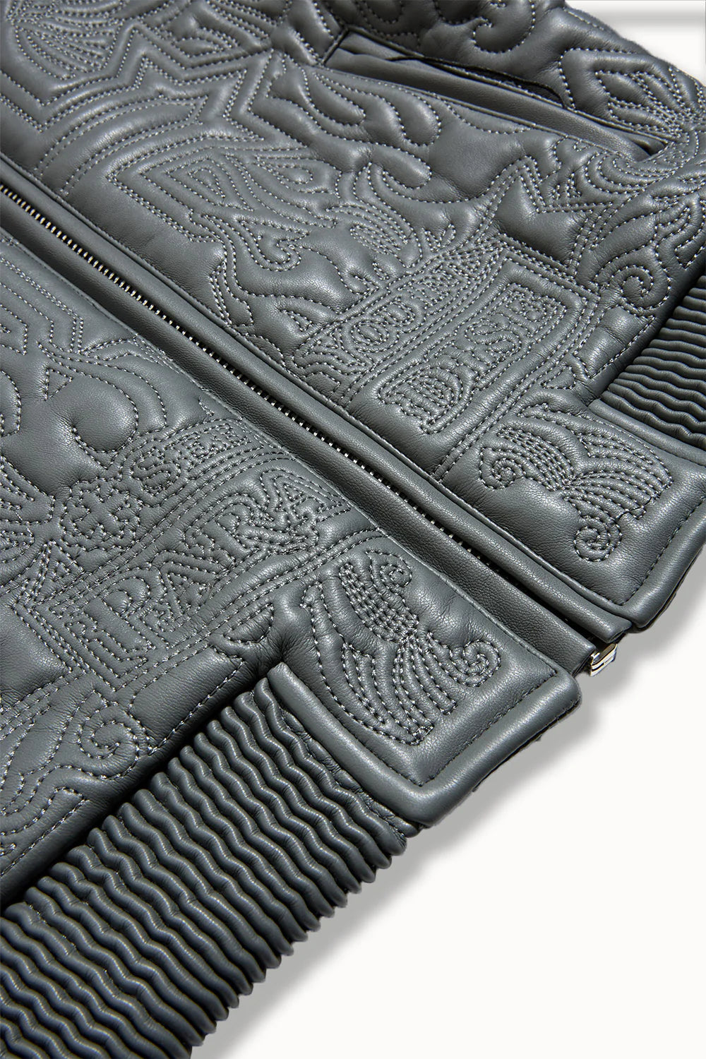 “Sinister Bomber Jacket – Charcoal: quilted embroidery, vegan leather accents, insulated channels, ribbed cuffs, and branded zippers for style and warmth.”