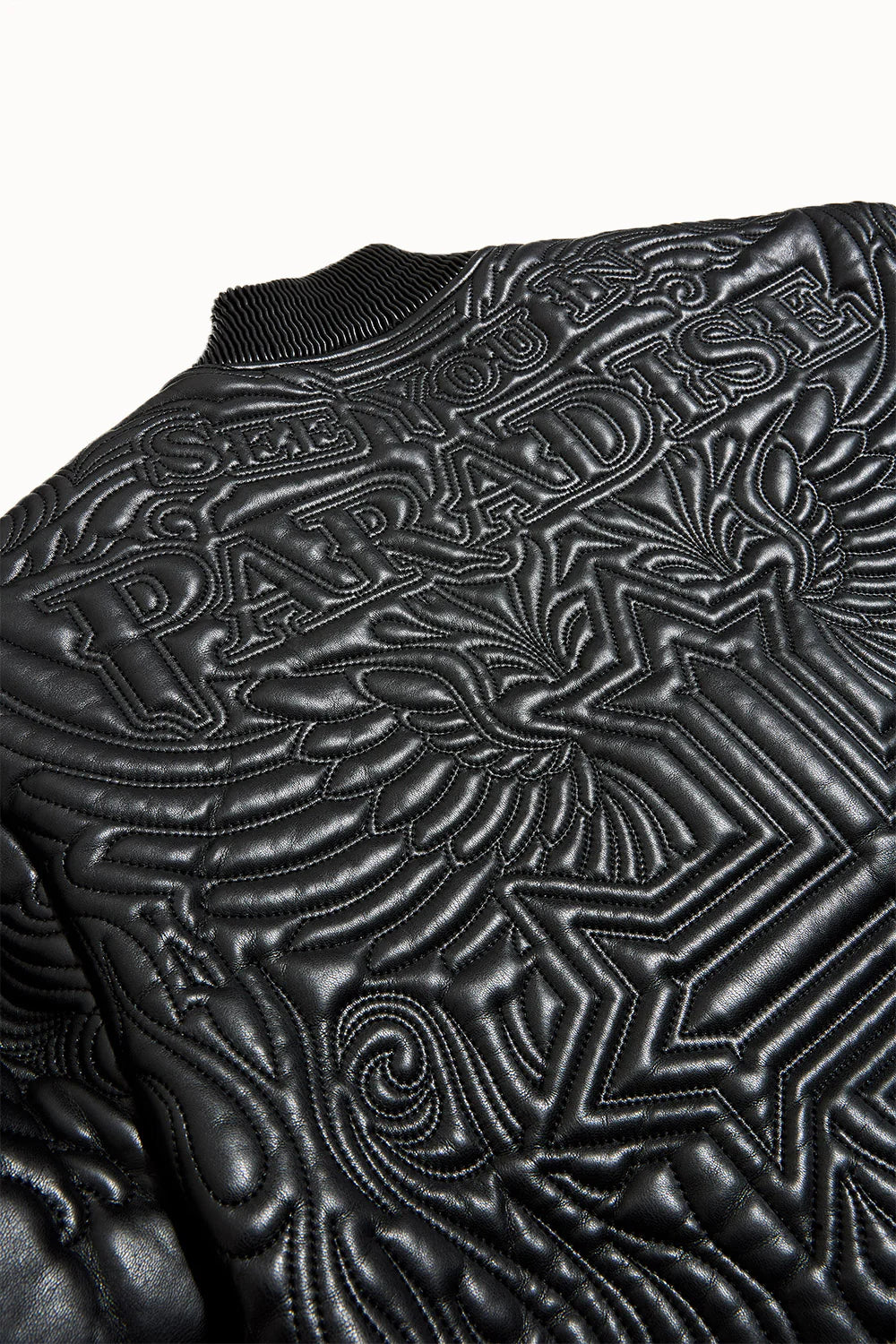 “Sinister Bomber Jacket – Charcoal: classic bomber silhouette, quilted embroidery, vegan leather accents, insulated channels, and branded zippers for style and warmth.”