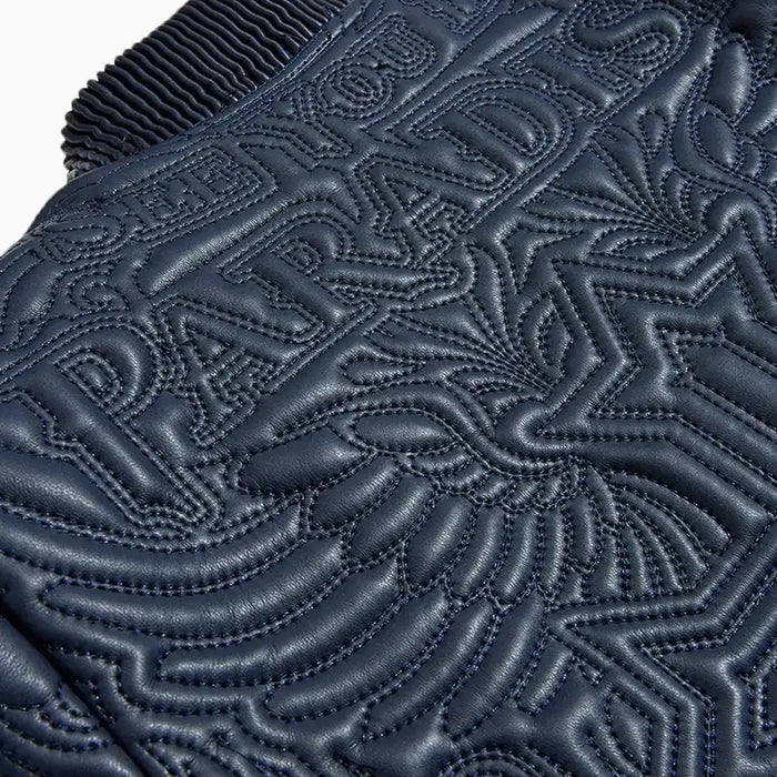 Jordan Craig Boys’ Sinister Bomber Jacket in navy with quilted embroidery, ribbed cuffs, and vegan leather accents.