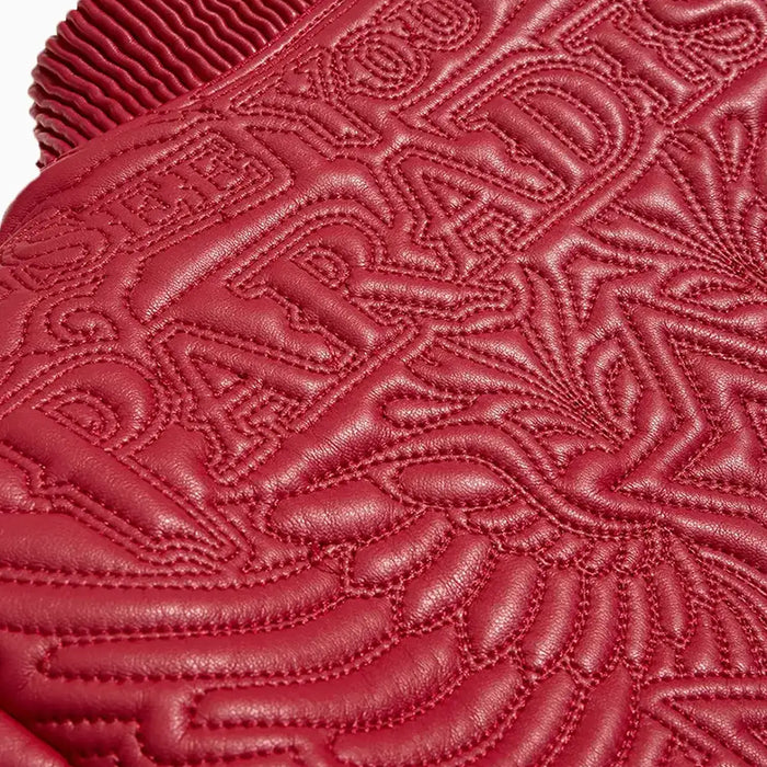 Jordan Craig Kid’s Sinister Bomber Jacket in red with quilted embroidery, ribbed cuffs, and vegan leather accents.