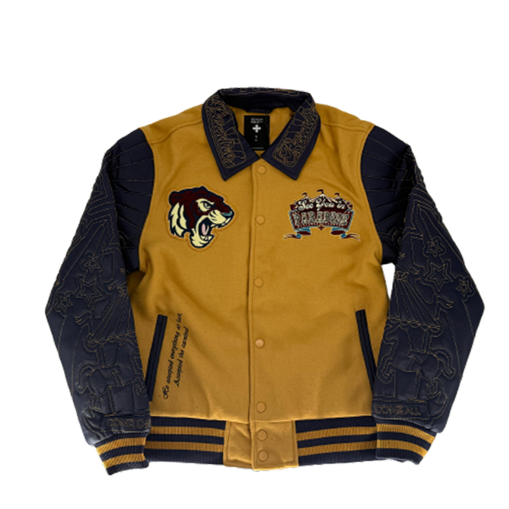 SYIP Team Varsity Jacket in mustard with wool body, vegan leather sleeves, chenille patches, and striped ribbed trims.