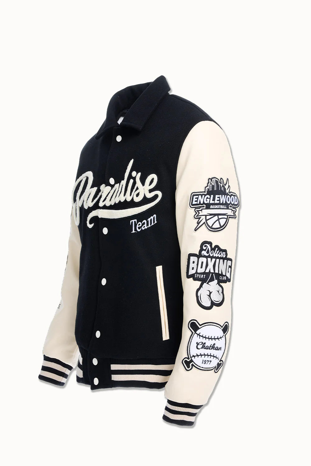 Black Paradise varsity jacket with wool body, vegan leather sleeves, chenille patches, and striped ribbed trims.