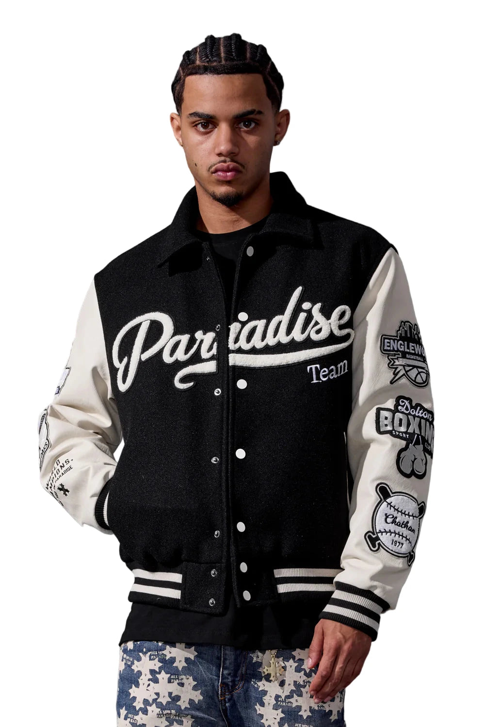 Black Paradise varsity jacket with wool body, vegan leather sleeves, chenille patches, and striped ribbed trims.