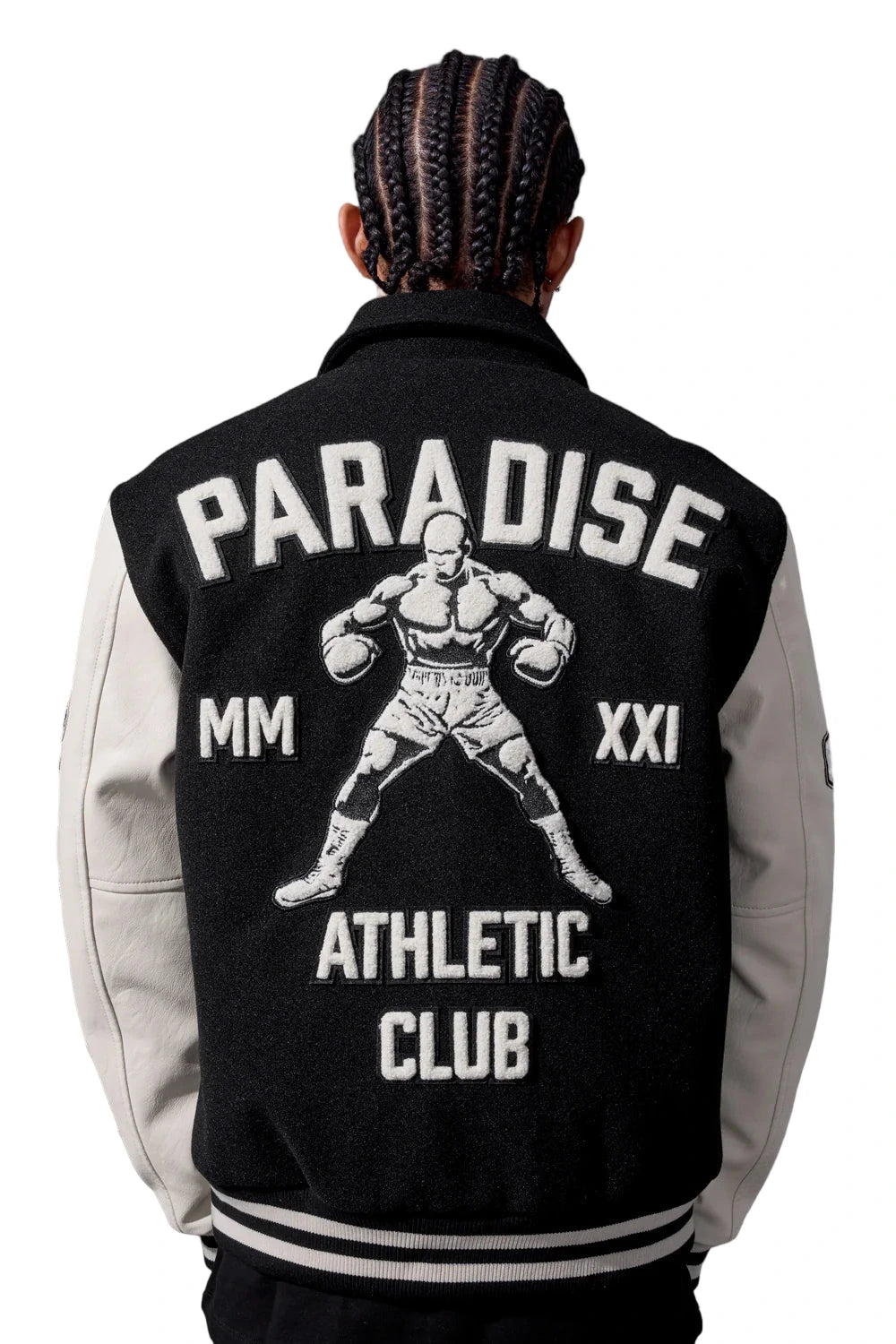 Black Paradise varsity jacket with wool body, vegan leather sleeves, chenille patches, and striped ribbed trims.