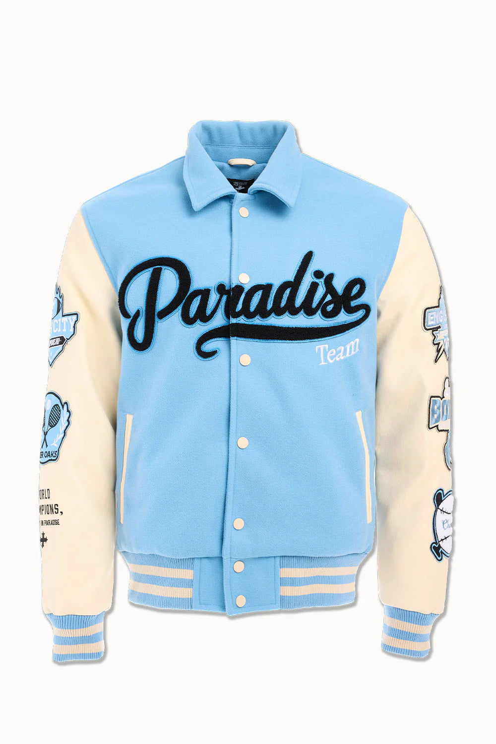 “Paradise Team Varsity Jacket – Sky Blue: wool body, quilted satin lining, vegan leather sleeves, chenille patches, embroidered details, and snap button front.”