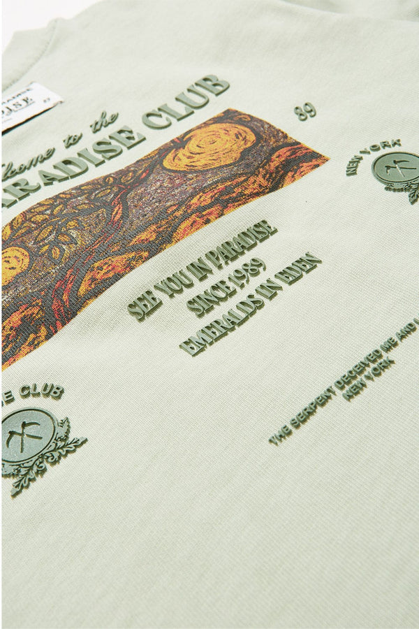 Textured fabric with decorative text and patterns on a light green background