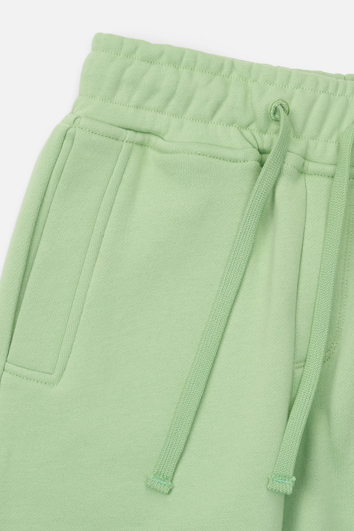 RtA Ewan sweatpant in green collegiate with logo detailing, elasticated waistband, and drawstring closure.