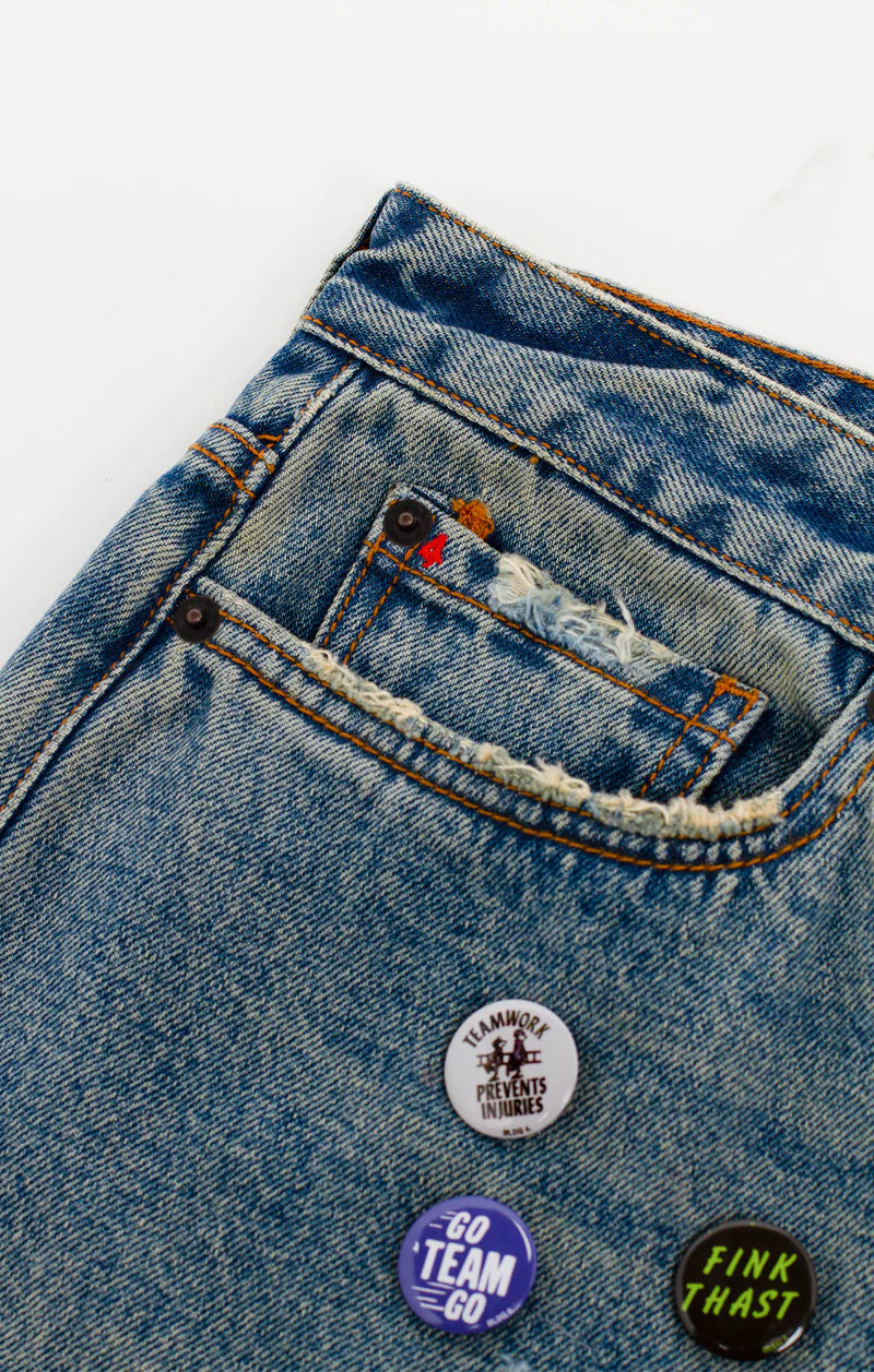 BLDG4 Pin Boy Short in Buster with 5-pocket design, brushing and breaking, repair stitching, and pin back buttons