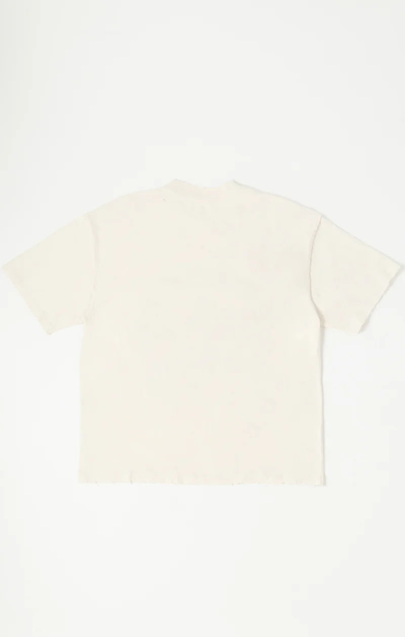Rockefeller Knit Tee in charcoal with snow-washed finish, peace-sign graphic made from layered buttons, applied metal pins, and distressed detailing