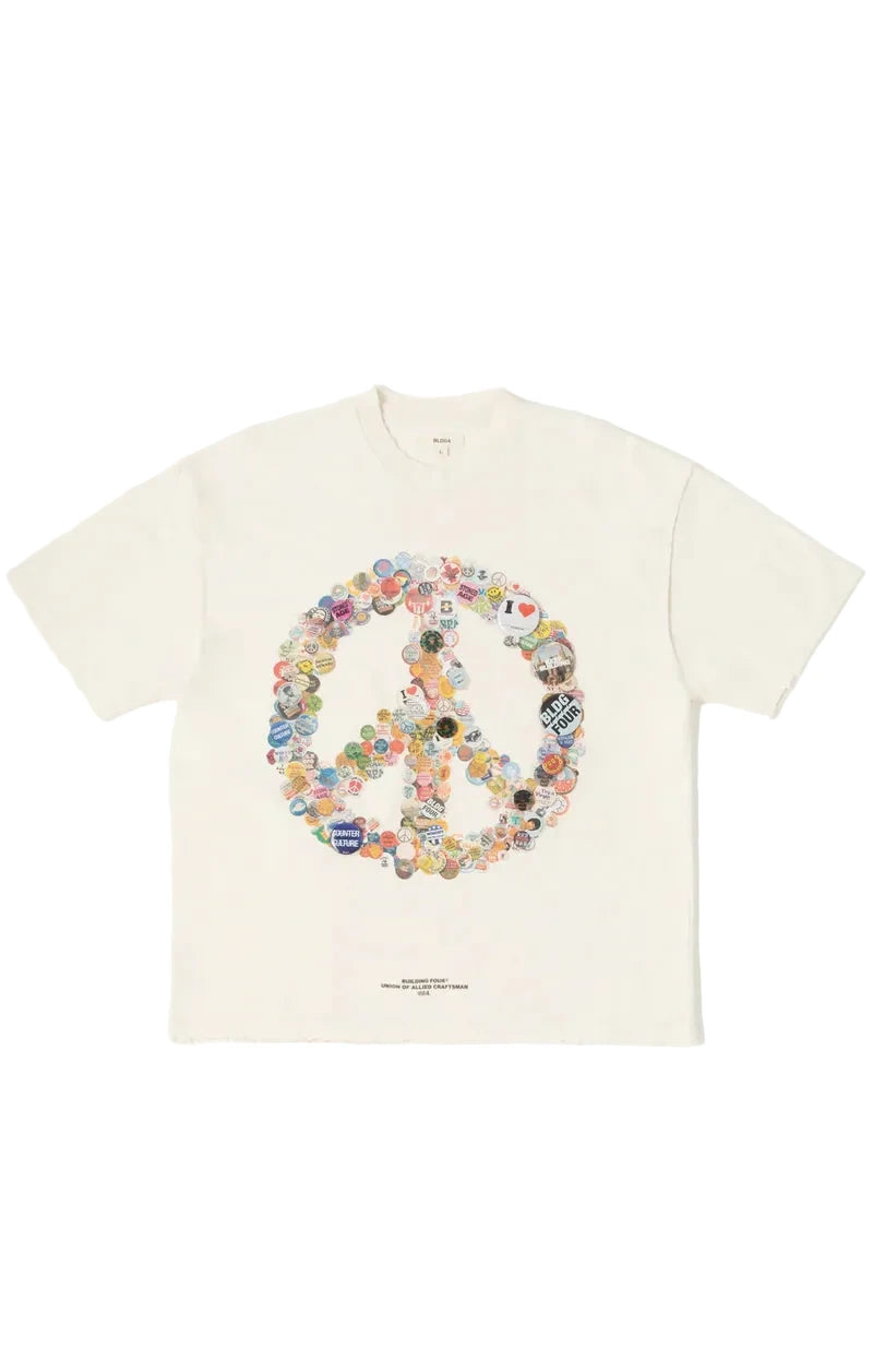 Rockefeller Knit Tee in charcoal with snow-washed finish, peace-sign graphic made from layered buttons, applied metal pins, and distressed detailing